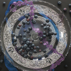 Garden blueberries on antique plate Garden blueberries on antique plate